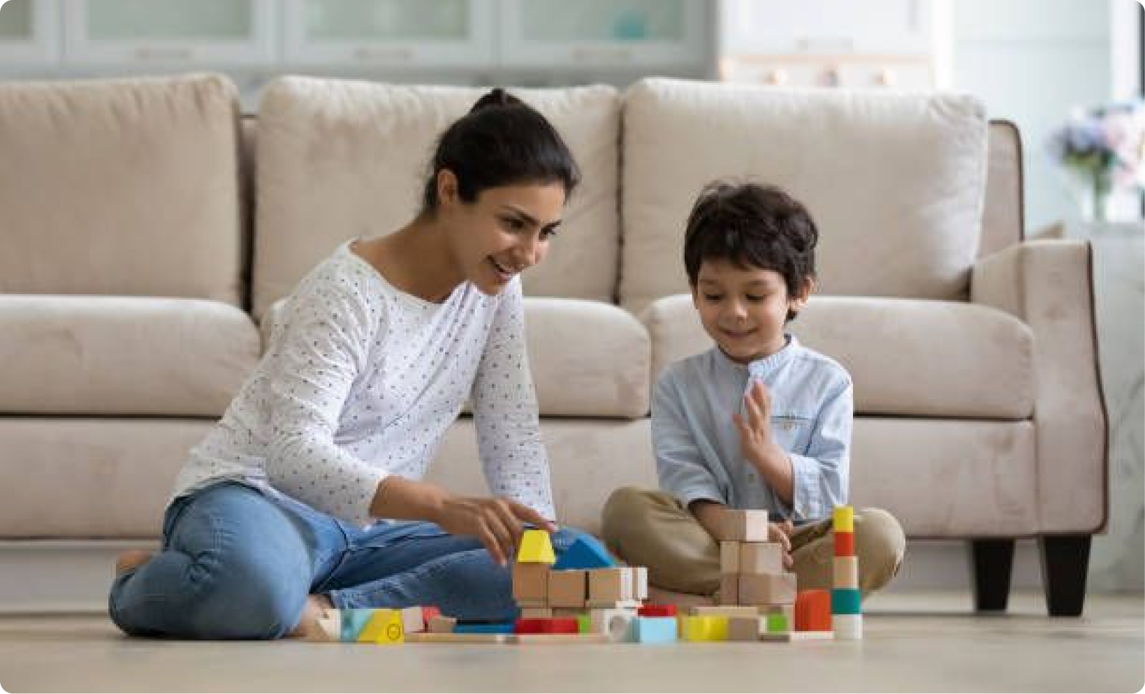 A mother and child building with blocks