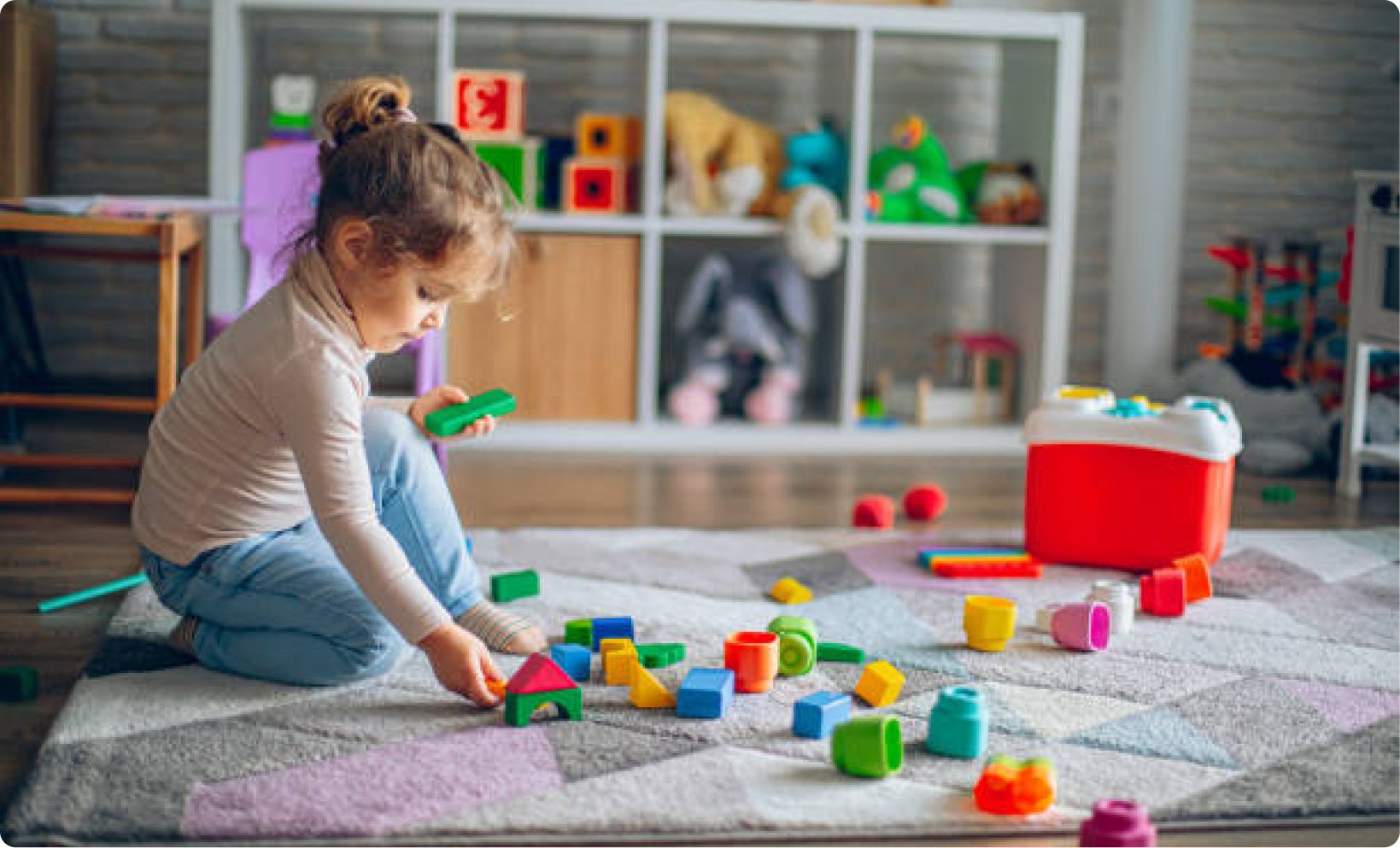A child building with colourful blocks
