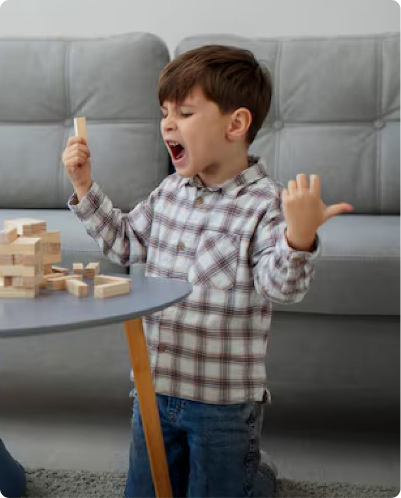 A child celebrating a completed creation